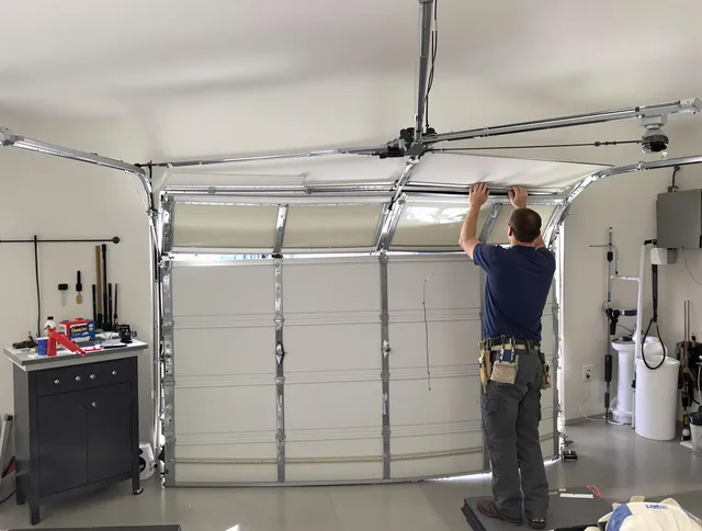 North Ridgeville Garage Door Repair specialist performing precise section replacement on North Ridgeville garage door